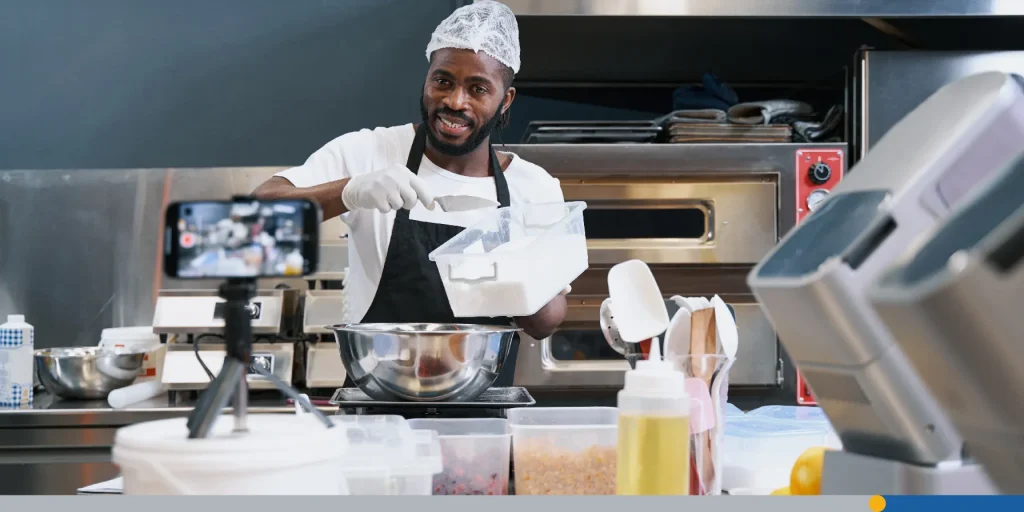 Person cooking in front of a camera. 