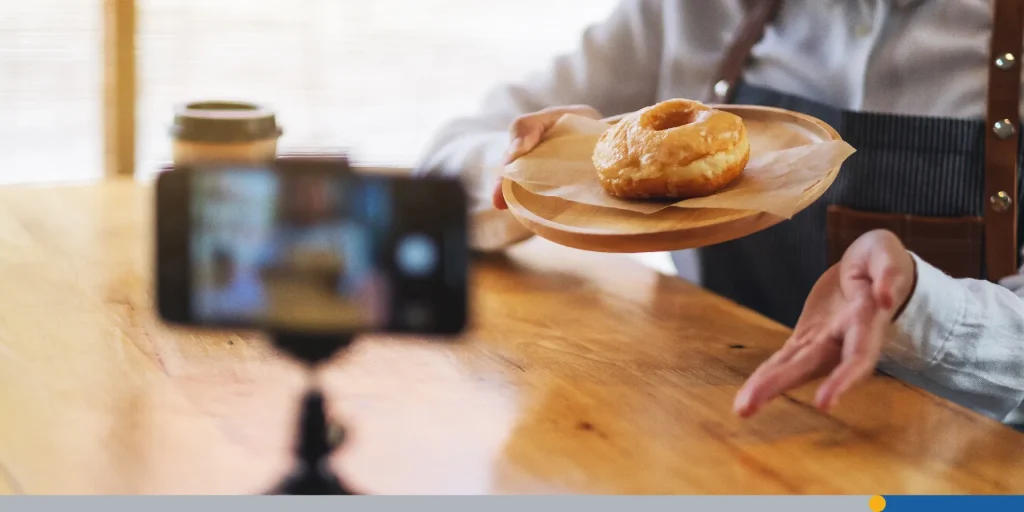 Person recording their doughnut recipe.