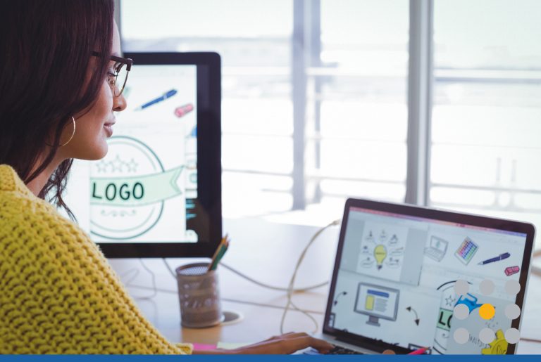 Woman creating a logo on her laptop