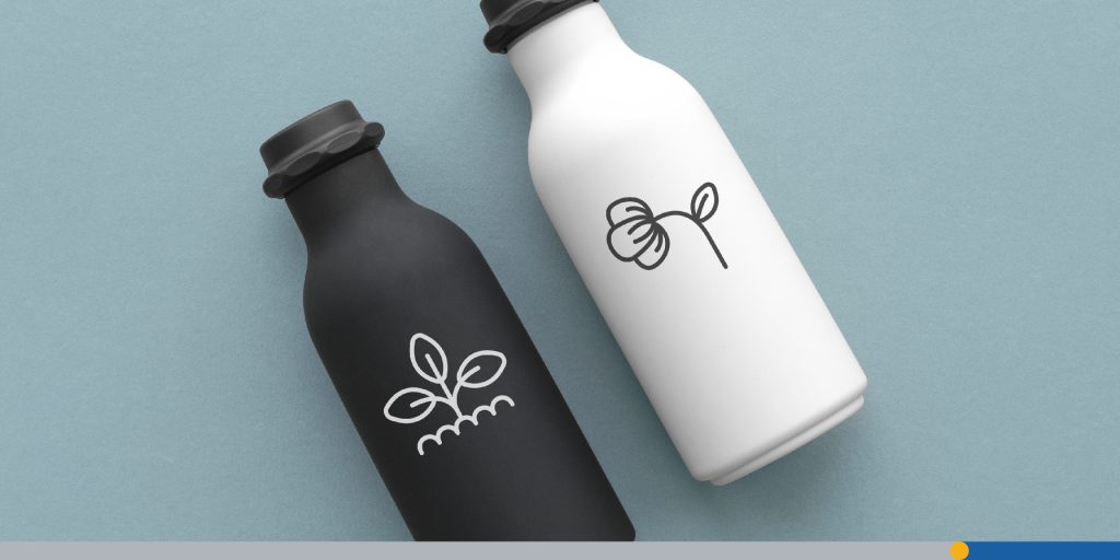 Transparent logos on two water bottles on a table