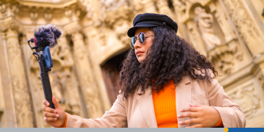 Woman taking a selfie in front of a church