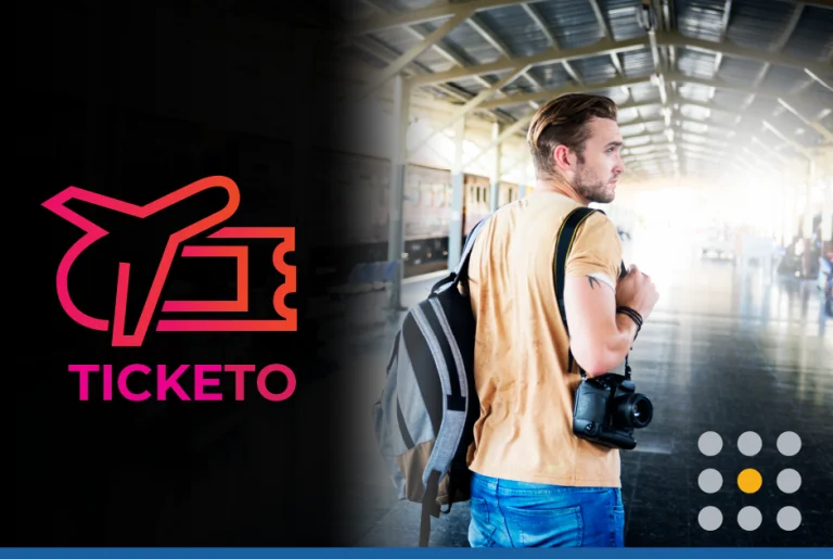 Man getting ready to board a train with a backpack and camera on his shoulder