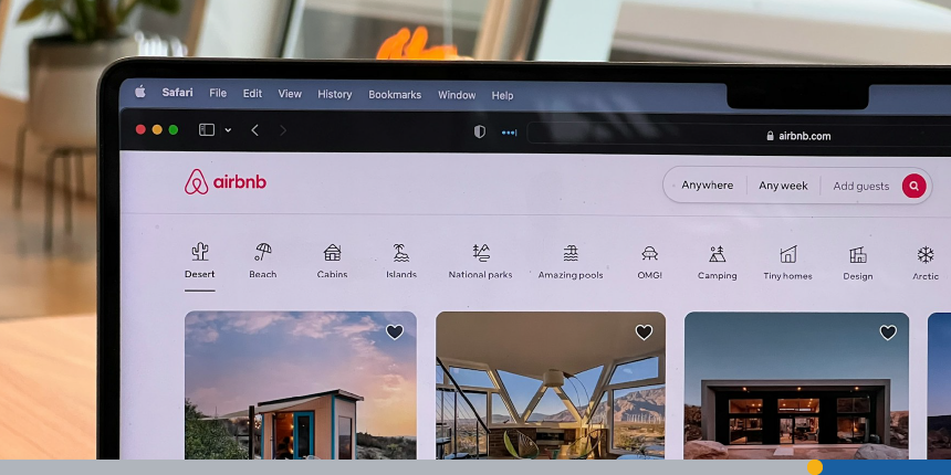 Someone looking at the Airbnb website on a laptop.