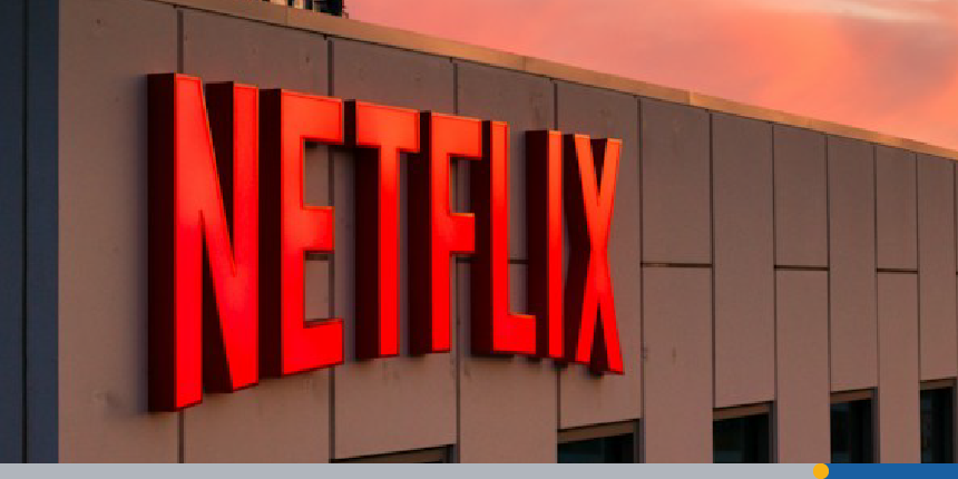 The Netflix sign is displayed on a building at sunset displaying one of the best logo fonts of modern times.