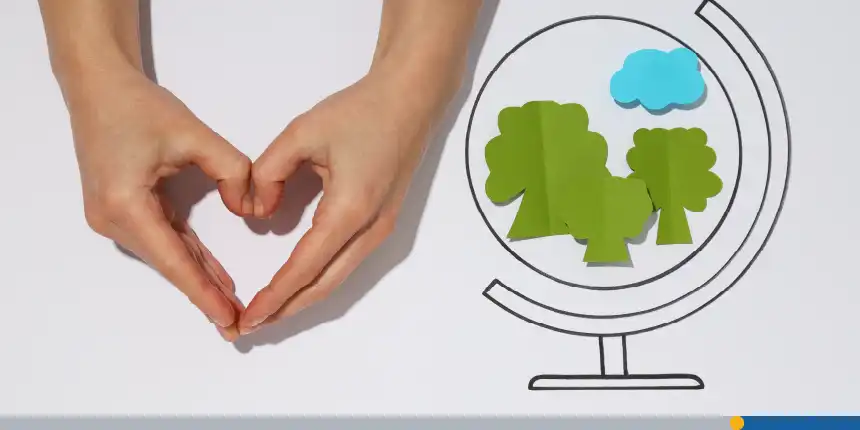 Hands creating a heart symbol next to a globe