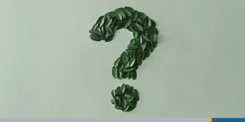 Question Mark formed of small fresh green leaves on a matching light green card with copy space