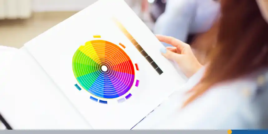 Close up of a female client examining color wheel in a book