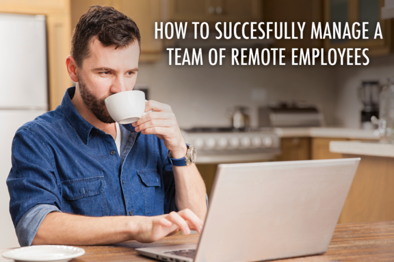 man sitting at desk drinking coffee looking at laptop