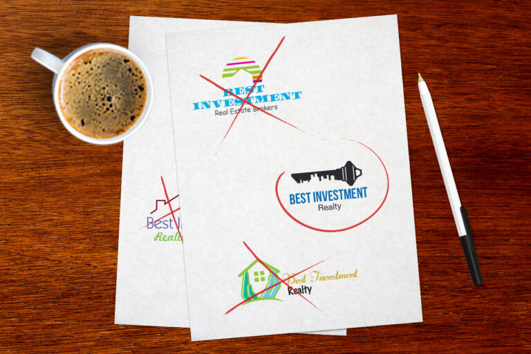 multiple logo designs displayed on paper