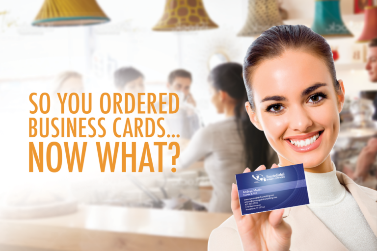 smiling woman holding business card